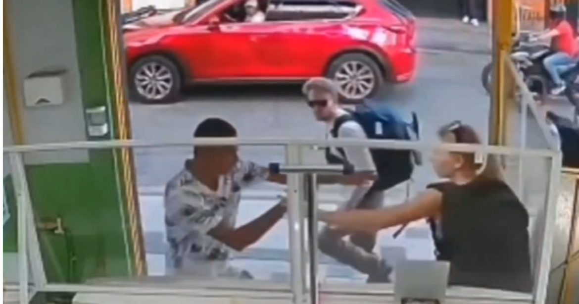 Watch: The Most Cowardly Man in the World? Tourist Shredded Online for Letting Knifeman Attack His Female Companion While He Ran and Hid